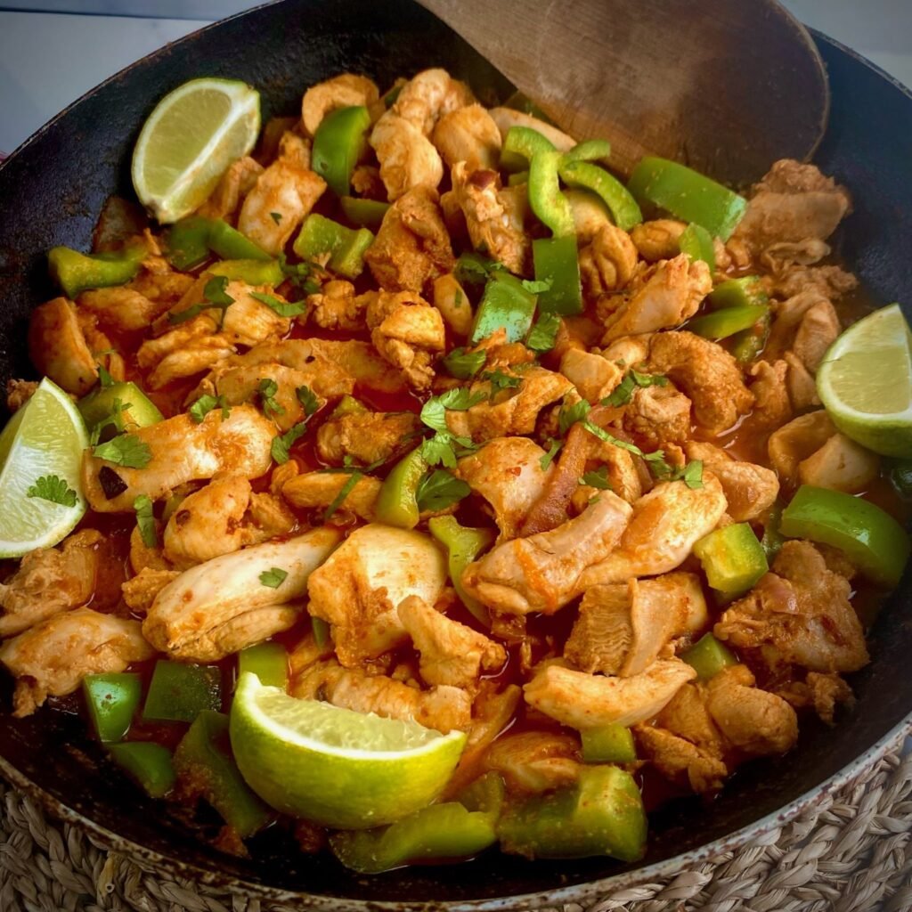 Chicken Fajitas in pan with Limes