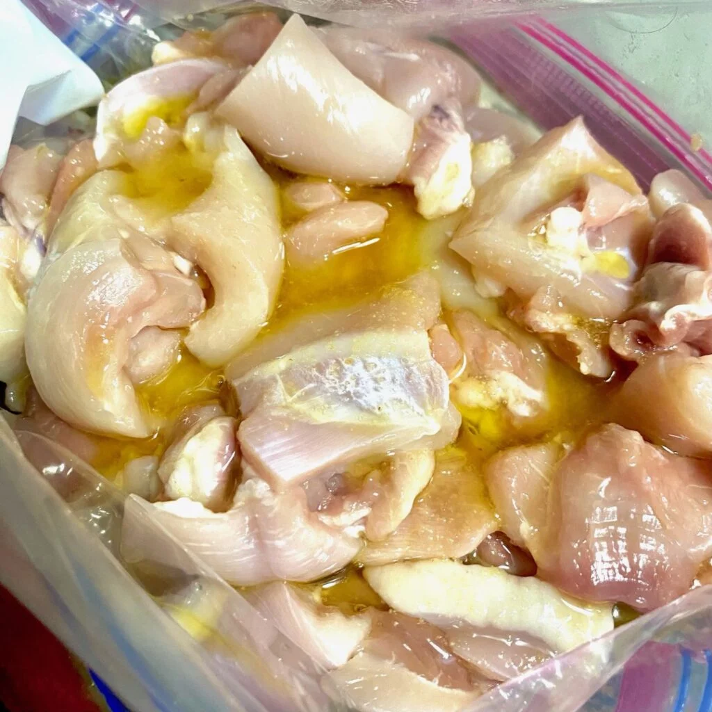Chicken marinating in Oil and Brine